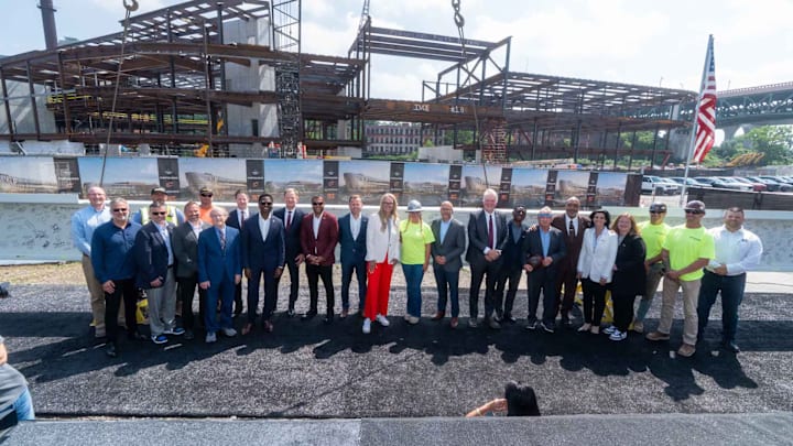 Cleveland Cavaliers executives, representatives from Cuyahoga County and the City of Cleveland, and workers on the Cleveland Clinic Global Peak Performance Center celebrated a major milestone on Tuesday.