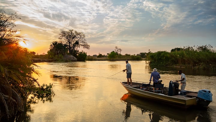 Anglers working the riverbank for African tigerfish.