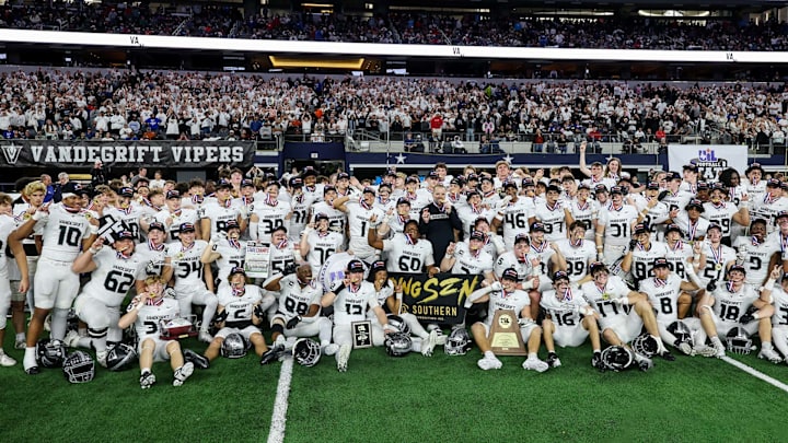 Vandegrift coaches and players pose for a team shot following their victory in the Texas 6A Division 2 title game at AT&T Stadium.
