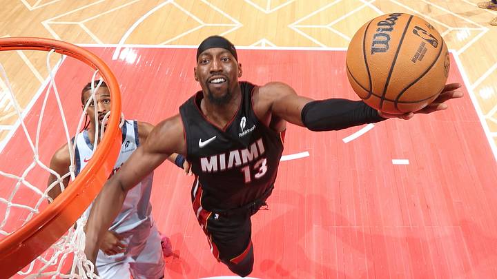 March 31, 2025, Washington, DC, USA: The Miami Heat's Bam Adebayo (13) attempts a layup after getting past Washington Wizards center Alex Sarr (left). March 31, 2025, Washington, DC, USA: The Miami Heat's Bam Adebayo (13) attempts a layup after getting past Washington Wizards center Alex Sarr (left).