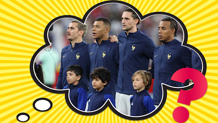 France's starting lineup with their "mascots" ahead of a match against Poland during the 2022 World Cup.