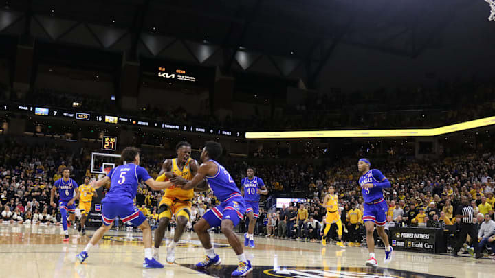  Dec 8, 2024; Columbia, Missouri, USA; Missouri Tigers forward Mark Mitchell (25) fights to protect the ball during a game against the Kansas Jayhawks