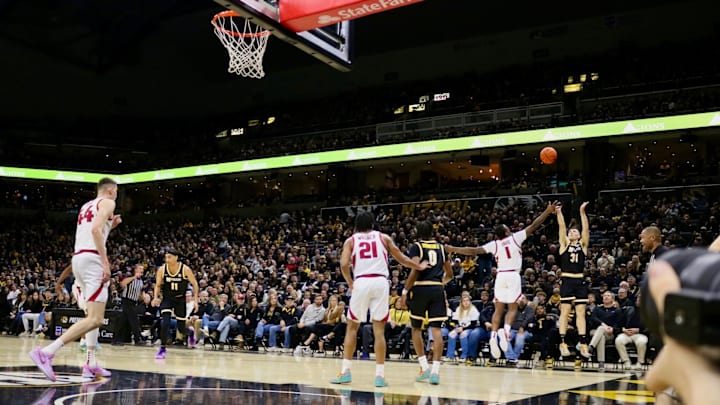 Jan. 18 2025; Columbia, Missouri, USA; Missouri Tigers guard Caleb Grill (31) leaps to attempt a three-point shot while Johnell Davis (1) raises his arm to defend the shot during a game at Mizzou Arena. Jan. 18 2025; Columbia, Missouri, USA; Missouri Tigers guard Caleb Grill (31) leaps to attempt a three-point shot while Johnell Davis (1) raises his arm to defend the shot during a game at Mizzou Arena.