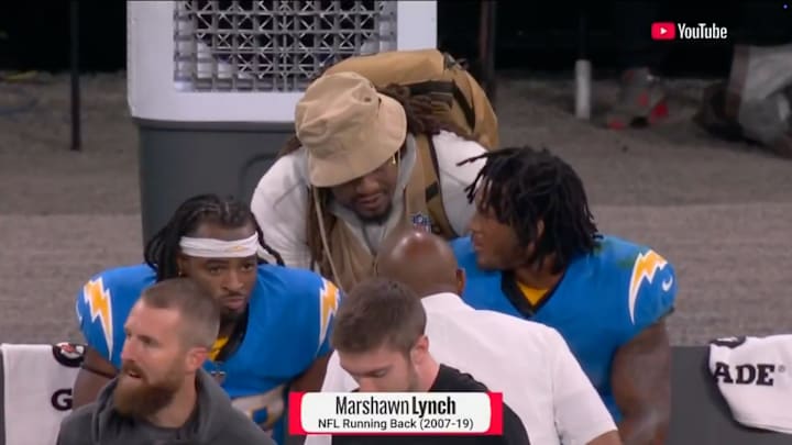 Running back-turned-photographer Marshawn Lynch gave Hampton some pointers after the Chargers rookie's mistake.