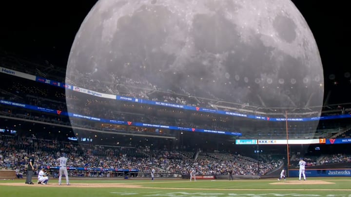 A Mets broadcast overlays the full moon with the night’s baseball action.
