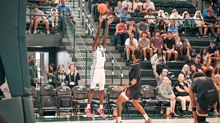 Tulane Forward Scotty Middleton Spots Up for a Three Tulane Forward Scotty Middleton Spots Up for a Three