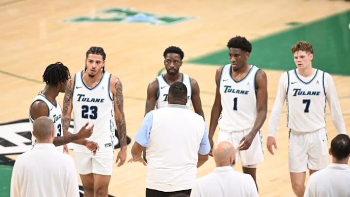Tulane five meet with coach Ron Hunter during a timeout. Tulane five meet with coach Ron Hunter during a timeout.