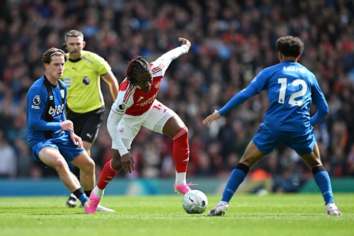 Tyler Adams (right) tackling Eberechi Eze (center).