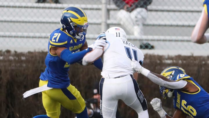 Delaware's Justis Henley (21) and Nijuel Hill put a stop to Villanova receiver Jaaron Hayek but not
