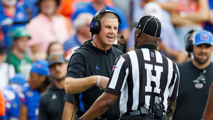 Florida Gators head coach Billy Napier discusses a call with the referee against the South Florida Bulls during the first half at Ben Hill Griffin Stadium. Credit: Matt Pendleton-Imagn Images