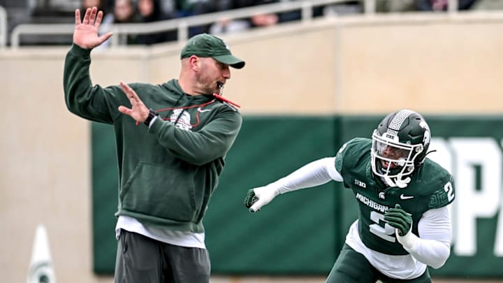 Michigan State's Khris Bogle, right, runs a drill with rush ends coach Chad Wilt during the Spring Showcase on Saturday, April 20, 2024, at Spartan Stadium in East Lansing.