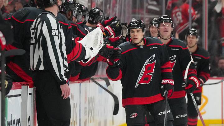 Apr 18, 2026; Raleigh, North Carolina, USA; Carolina Hurricanes center Logan Stankoven (22) celebrates his goal against the Ottawa Senators during the second period in game one of the first round of the 2026 Stanley Cup Playoffs at Lenovo Center. Mandatory Credit: James Guillory-Imagn Images
