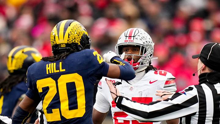 Michigan Wolverines defensive back Jyaire Hill (20) and Ohio State Buckeyes running back Bo Jackson (25) are separated in the first half of the NCAA football game at Michigan Stadium on Saturday, Nov. 29, 2025 in Ann Arbor, Michigan. Michigan Wolverines defensive back Jyaire Hill (20) and Ohio State Buckeyes running back Bo Jackson (25) are separated in the first half of the NCAA football game at Michigan Stadium on Saturday, Nov. 29, 2025 in Ann Arbor, Michigan.
