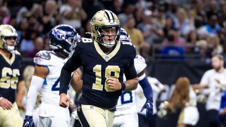 Aug 25, 2024; New Orleans, Louisiana, USA;  New Orleans Saints quarterback Spencer Rattler (18) reacts to passing a touchdown against the Tennessee Titans during the first half at Caesars Superdome. Mandatory Credit: Stephen Lew-USA TODAY Sports