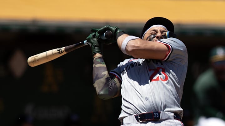 Jun 22, 2024; Oakland, California, USA; Minnesota Twins designated hitter Royce Lewis (23) ducks away from a high and tight pitch from Oakland Athletics pitcher Osvaldo Bido during the third inning at Oakland-Alameda County Coliseum. Mandatory Credit: D. Ross Cameron-USA TODAY Sports