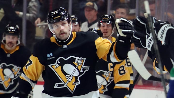Nov 27, 2024; Pittsburgh, Pennsylvania, USA;  Pittsburgh Penguins right wing Bryan Rust (17) celebrates his second goal of the game with the Penguins bench against the Vancouver Canucks during the second period at PPG Paints Arena. Mandatory Credit: Charles LeClaire-Imagn Images