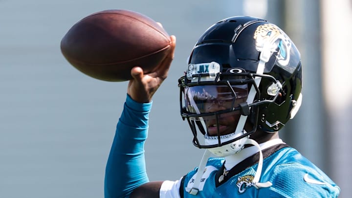 Jacksonville Jaguars wide receiver Travis Hunter (12) throws back the ball after running a passing drill during the Jacksonville Jaguars’ third mandatory minicamp Thursday June 12, 2025 at the Miller Electric Center in Jacksonville, Fla. [Doug Engle/Florida Times-Union]
