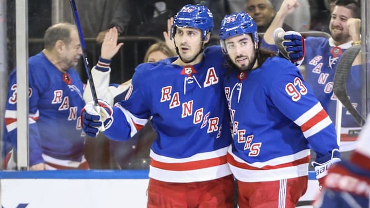 Feb 15, 2024; New York, New York, USA; New York Rangers left wing Chris Kreider (20) celebrates with center Mika Zibanejad (93) after scoring a goal in the second period against the Montreal Canadiens at Madison Square Garden. Mandatory Credit: Wendell Cruz-Imagn Images