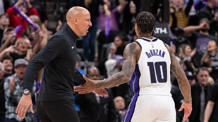 Jan 6, 2025; Sacramento, California, USA; Sacramento Kings head coach Doug Christie celebrates with forward DeMar DeRozan (10) in double overtime in the game against the Miami Heat at Golden 1 Center. Mandatory Credit: Ed Szczepanski-Imagn Images