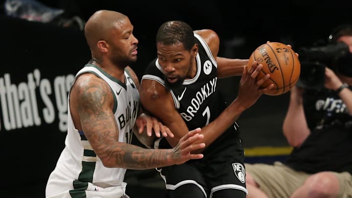 Jun 5, 2021; Brooklyn, New York, USA; Brooklyn Nets power forward Kevin Durant (7) controls the ball against Milwaukee Bucks power forward P.J. Tucker (left) during the second quarter of game one in the Eastern Conference semifinals of the 2021 NBA Playoffs at Barclays Center. Mandatory Credit: Brad Penner-Imagn Images Jun 5, 2021; Brooklyn, New York, USA; Brooklyn Nets power forward Kevin Durant (7) controls the ball against Milwaukee Bucks power forward P.J. Tucker (left) during the second quarter of game one in the Eastern Conference semifinals of the 2021 NBA Playoffs at Barclays Center. Mandatory Credit: Brad Penner-Imagn Images