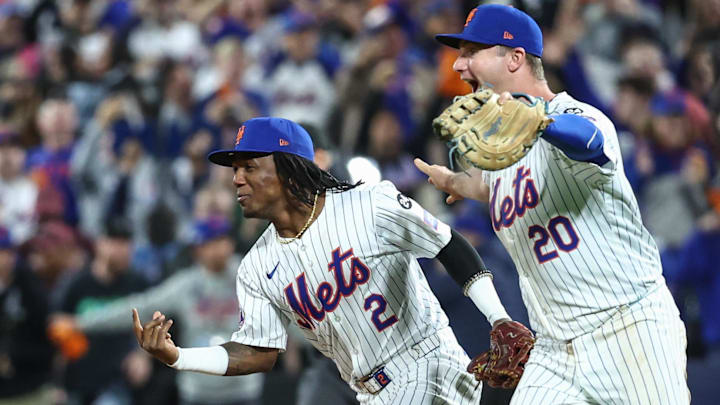 Oct 9, 2024; New York City, New York, USA; New York Mets second baseman Luisangel Acuna (2) and first baseman Pete Alonso (20) during game four of the NLDS for the 2024 MLB Playoffs at Citi Field. Mandatory Credit: Wendell Cruz-Imagn Images