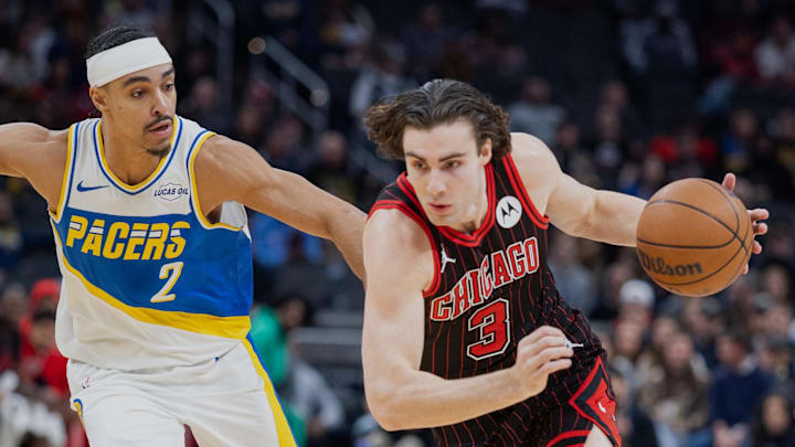 Nov 29, 2025; Indianapolis, Indiana, USA; Chicago Bulls guard Josh Giddey (3) drives with the ball against Indiana Pacers guard Andrew Nembhard (2) during the first half at Gainbridge Fieldhouse. Mandatory Credit: Trevor Ruszkowski-Imagn Images