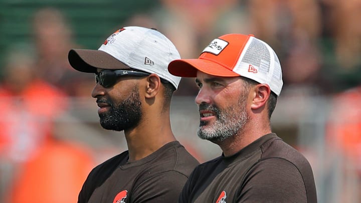 Browns GM Andrew Berry, left, and coach Kevin Stefanski watch practice in training camp, Saturday, July 31, 2021, in Berea.