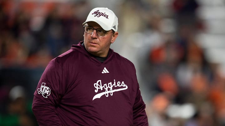 Texas A&M Aggies head coach Mike Elko during warm-ups before the Aggies take on the Auburn Tigers at Jordan-Hare Stadium in Auburn, Ala., on Saturday, Sept. 7, 2024.