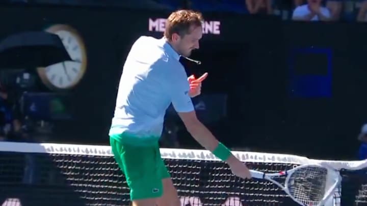Daniil Medvedev takes out his frustration on a net camera at the Australian Open.