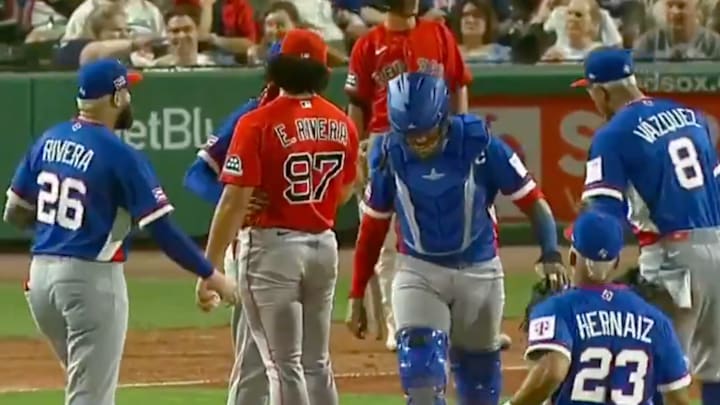 Puerto Rico's conference at the mound featured a player in a Red Sox jersey.