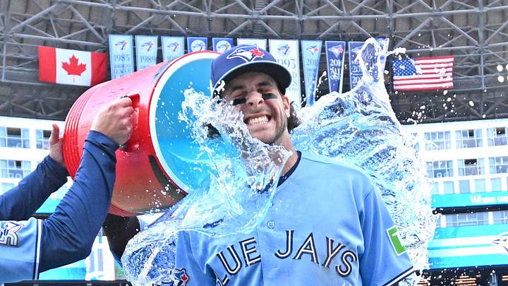 Jun 6, 2026; Toronto, Ontario, CAN;  Toronto Blue Jays second baseman Ernie Clement (22) is doused with ice water as he celebrates a win over the Baltimore Orioles at Rogers Centre. Mandatory Credit: Dan Hamilton-Imagn Images