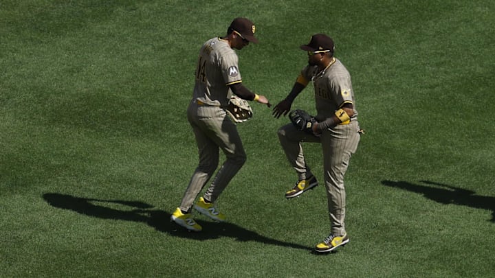 San Diego Padres outfielder Tyler Wade (14) celebrates with Padres first baseman Luis Arraez (4) after their game against the Washington Nationals at Nationals Park on July 20.
