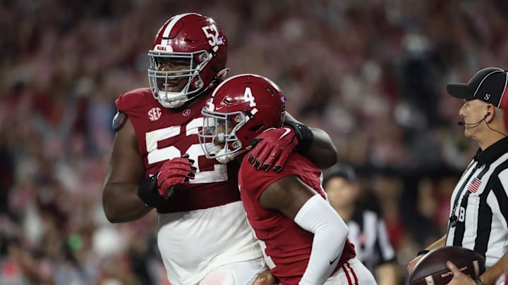 Tyler Booker and Jalen Milroe