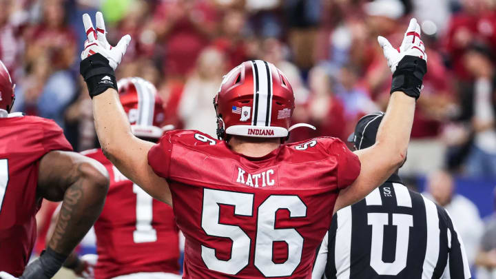 Indiana offensive lineman Mike Katic signals for a touchdown. Indiana offensive lineman Mike Katic signals for a touchdown.