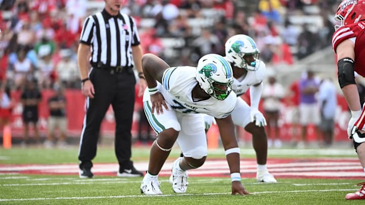 Tulane Defensive Lineman Kameron Hamilton in his old jersey #70 prepares for the next play. Tulane Defensive Lineman Kameron Hamilton in his old jersey #70 prepares for the next play.