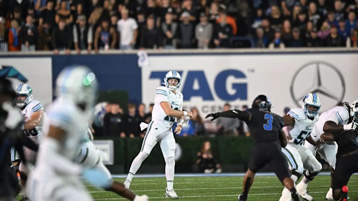 Tulane Quarterback Jake Retzlaff Finds an Open Receiver Downfield against the Memphis Tigers Tulane Quarterback Jake Retzlaff Finds an Open Receiver Downfield against the Memphis Tigers