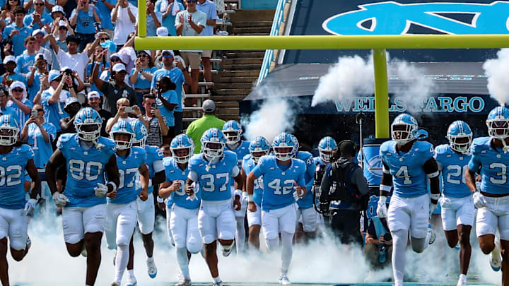 The North Carolina Tar Heels run onto the field before their game against Richmond at Kenan Stadium on Sept. 13, 2025. The North Carolina Tar Heels run onto the field before their game against Richmond at Kenan Stadium on Sept. 13, 2025.