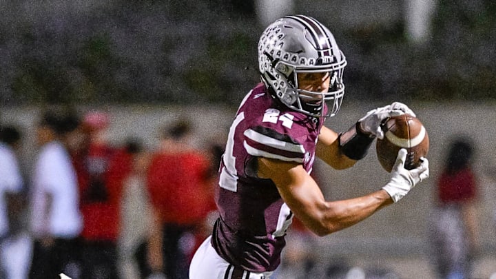 Mt. Whitney's Israel Briggs takes a pass against Mission Oak in non-league high school football on Friday, September 13, 2024.