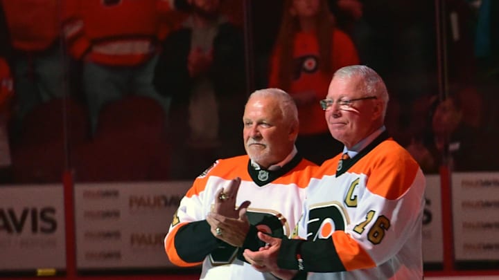 Oct 27, 2016; Philadelphia, PA, USA; Philadelphia Flyers greats Bernie Parent (1) and Bobby Clarke (16) on ice during ceremony before game against Arizona Coyotes at Wells Fargo Center. Mandatory Credit: Eric Hartline-Imagn Images