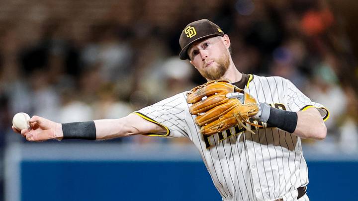 Sep 13, 2025; San Diego, California, USA; San Diego Padres shortstop Jake Cronenworth (9) throws to first base for an out during the sixth inning against the Colorado Rockies at Petco Park. Mandatory Credit: David Frerker-Imagn Images
