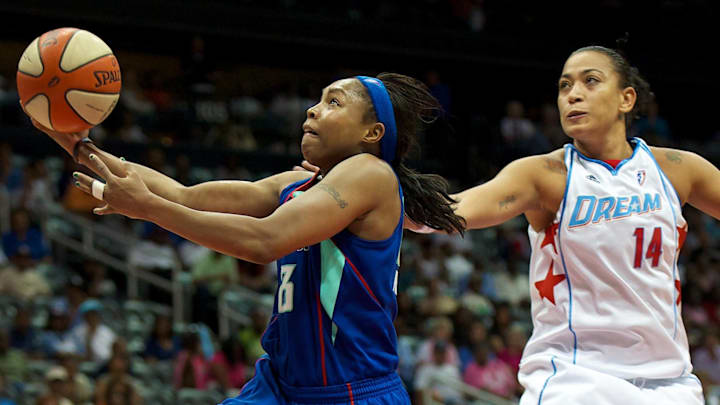 September 7, 2010; Atlanta, GA, USA; New York Liberty guard Cappie Pondexter (left) goes past Atlanta Dream center Erika de Souza (14) on the way to scoring two points in the second half of game two of the Eastern Conference Finals at Philips Arena. The Dream defeated the Liberty 105-93 to win the series two games to none. Mandatory Credit: Dale Zanine-Imagn Images September 7, 2010; Atlanta, GA, USA; New York Liberty guard Cappie Pondexter (left) goes past Atlanta Dream center Erika de Souza (14) on the way to scoring two points in the second half of game two of the Eastern Conference Finals at Philips Arena. The Dream defeated the Liberty 105-93 to win the series two games to none. Mandatory Credit: Dale Zanine-Imagn Images