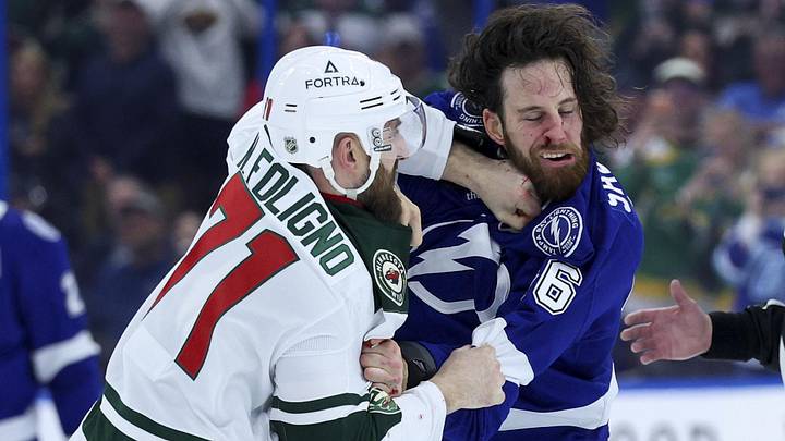 Mar 24, 2026; Tampa, Florida, USA; Tampa Bay Lightning right wing Scott Sabourin (46) and Minnesota Wild left wing Nick Foligno (71) fight in the first period at Benchmark International Arena. Mandatory Credit: Nathan Ray Seebeck-Imagn Images