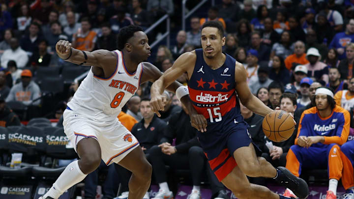 Dec 28, 2024; Washington, District of Columbia, USA; Washington Wizards guard Malcolm Brogdon (15) drives to the basket as New York Knicks forward OG Anunoby (8) defends in the fourth quarter at Capital One Arena. Mandatory Credit: Geoff Burke-Imagn Images