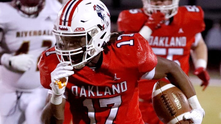 Oakland's Daune Morris (17) runs the ball down the field for a touchdown against Riverdale during the quarterfinal football game at Oakland, on Friday, Nov. 22, 2024.