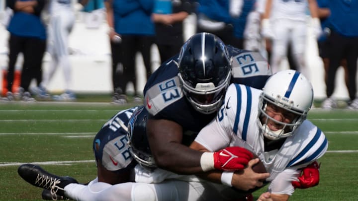 Tennessee Titans wide receiver Nick Westbrook-Ikhine (15) is brought down by Tennessee Titans defensive tackle T'Vondre Sweat (93) and linebacker Harold Landry III (58) during the fourth quarter of their game at Nissan Stadium in Nashville, Tenn., Sunday, Oct. 13, 2024. Tennessee Titans wide receiver Nick Westbrook-Ikhine (15) is brought down by Tennessee Titans defensive tackle T'Vondre Sweat (93) and linebacker Harold Landry III (58) during the fourth quarter of their game at Nissan Stadium in Nashville, Tenn., Sunday, Oct. 13, 2024.