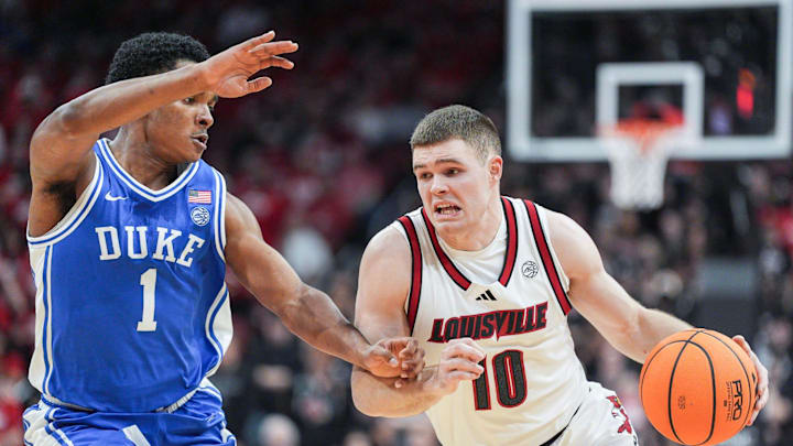 Duke Blue Devils guard Caleb Foster (1) guards Louisville Cardinals guard Isaac McKneely (10) during ACC play January 6, 2026. Duke Blue Devils guard Caleb Foster (1) guards Louisville Cardinals guard Isaac McKneely (10) during ACC play January 6, 2026.