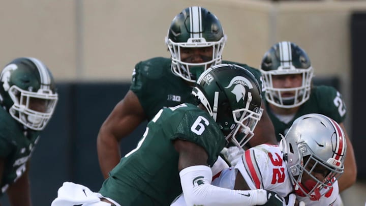 Michigan State Spartans cornerback Ameer Speed (6) tackles Ohio State Buckeyes running back TreVeyon Henderson (32) during first half action at Spartan Stadium Saturday, October 8, 2022.

Msuosu 100822 Kd 0013201