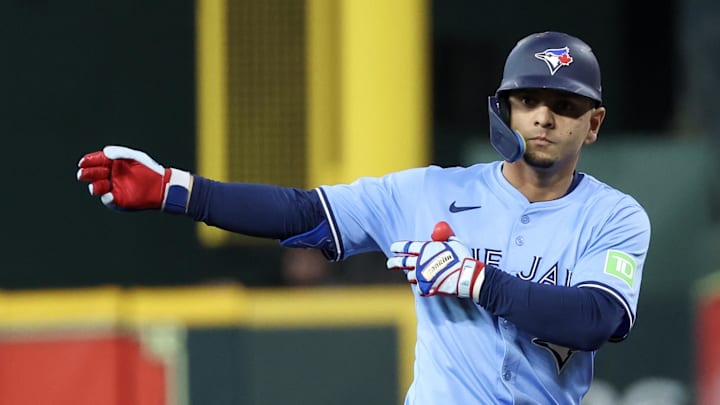 Houston, Texas, USA; Toronto Blue Jays second baseman Andres Gimenez (0) reacts to his single against the Houston Astros in the second inning at Daikin Park.