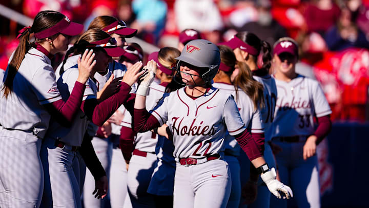 Addison Foster (22) makes her way down line getting high fives from her teammates.