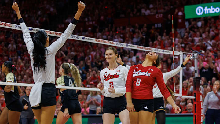 Nebraska volleyball players celebrate a point against Purdue. The Huskers won in five sets. Nebraska volleyball players celebrate a point against Purdue. The Huskers won in five sets.